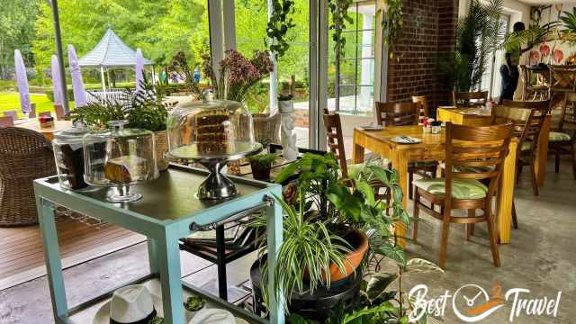 A cafe with plenty of fresh baked cakes.