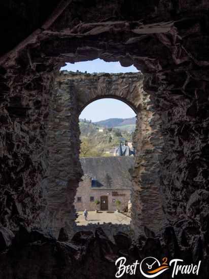View out of the castle tower to the outer walls and restaurant