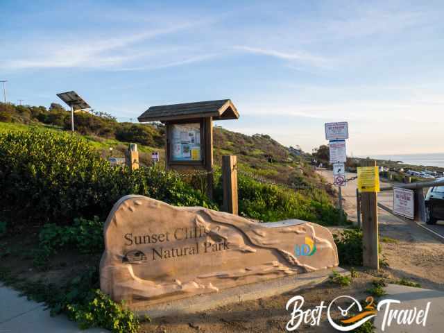 The entrance to the Nature Park and the parking to the right.