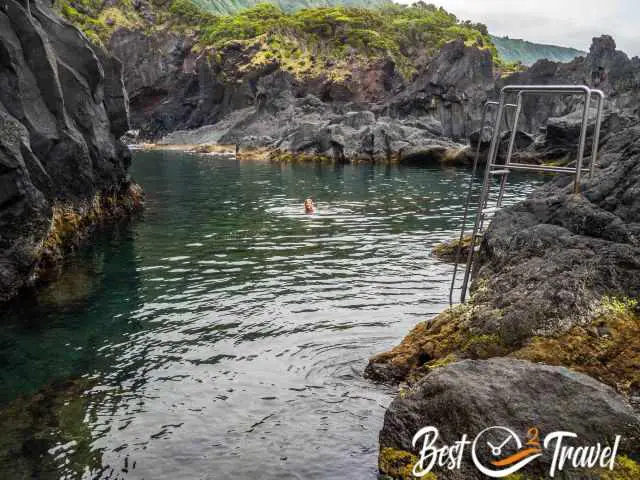 A woman in the huge natural pool at low tide