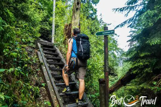 A hiker on a staircase to Carolafelsen