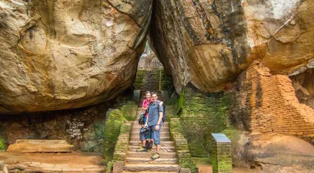 A couple on a staircase entrance at Sigiriya