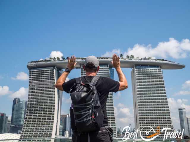 A man "holding" the hotel - Fun photo