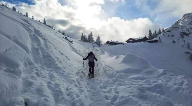 hiking uphill with snowshoes