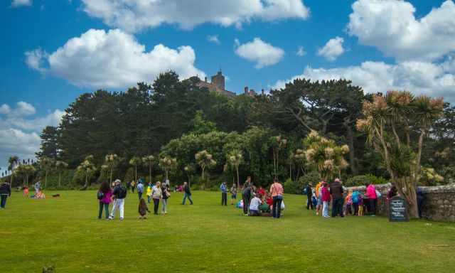 The garden is full of people during midday