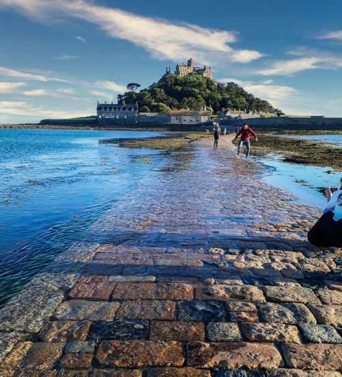 People on the causeway during incoming tide.