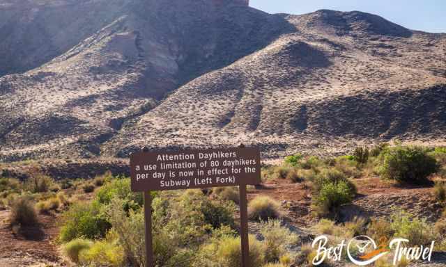 A sign indicating a permit is needed and limit 80 hikers