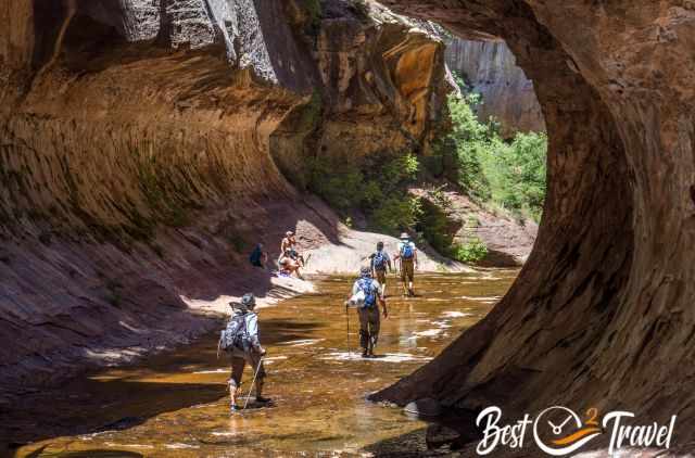 A group of four in the Subway with hiking poles