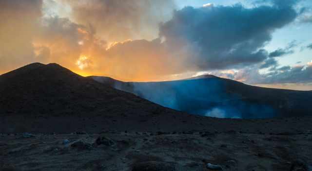 Reaching Yasur volcano before darkness with ash clouds above