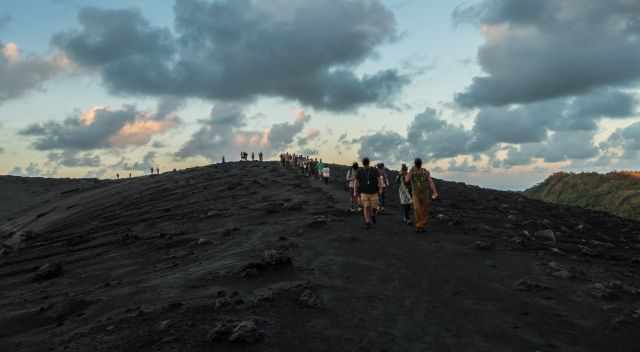 Our group is reaching the crater rim of Yasur volcano