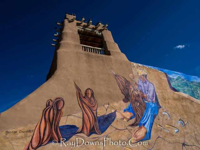 Painting by an artist outside a building.