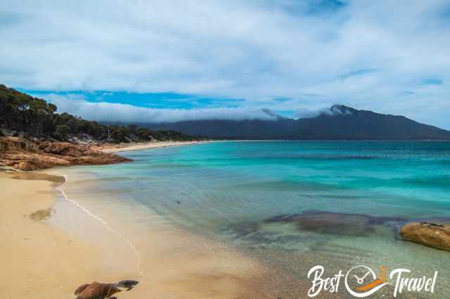 The crystal clear water and white sand and Hazards Beach