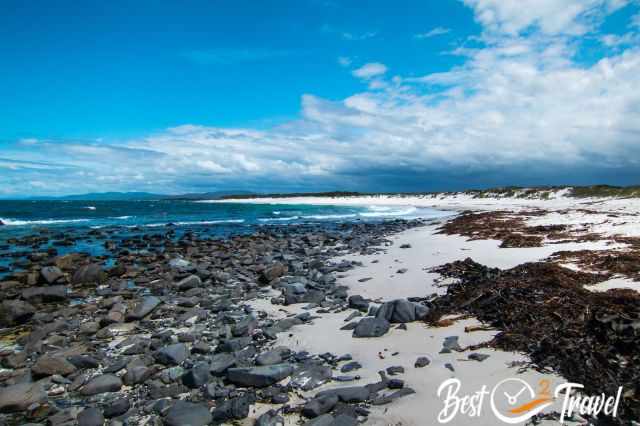 A white beach stretching for many kilometers and a blue sky