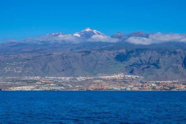 Snow covered Teide and Tenerife seen from the boat.