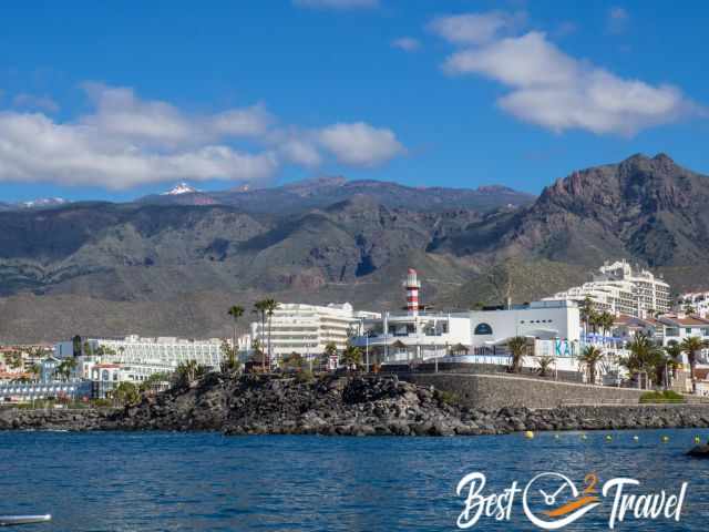 Puerto Colon Harbour, several bigger hotels, and Teide in the distance..