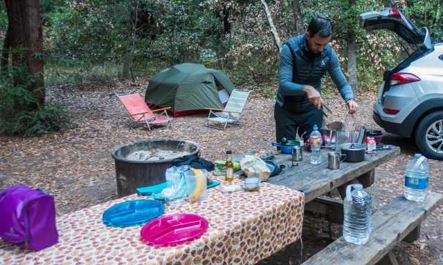 A campsite in Canada with table, bench, our tent