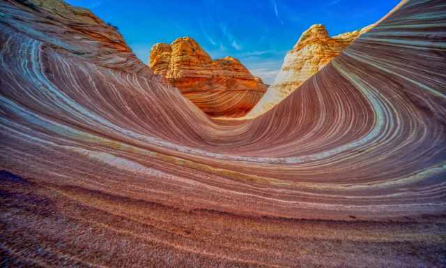 The Wave and two of the high buttes in the back