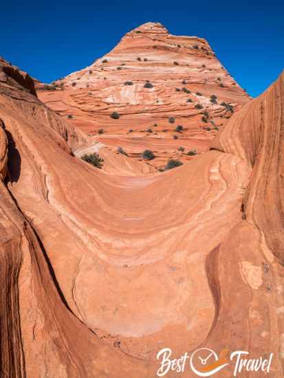 A narrow sandstone slope.