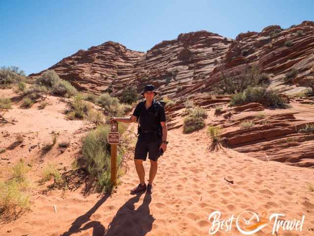  A hiker next to a Wave sign