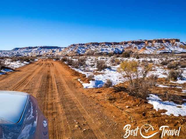 The red and sandy gravel road in Escalante in winter.