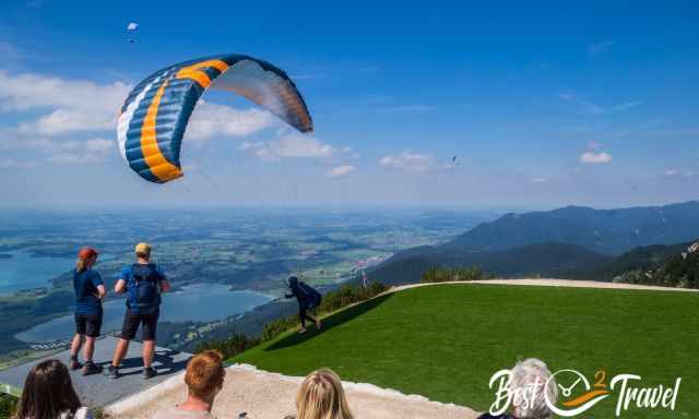 A paraglider starting from the platform