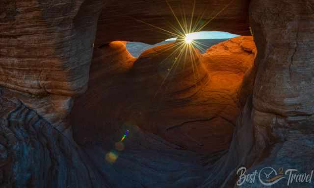 The Valley of Fire view through a window arch to the sun