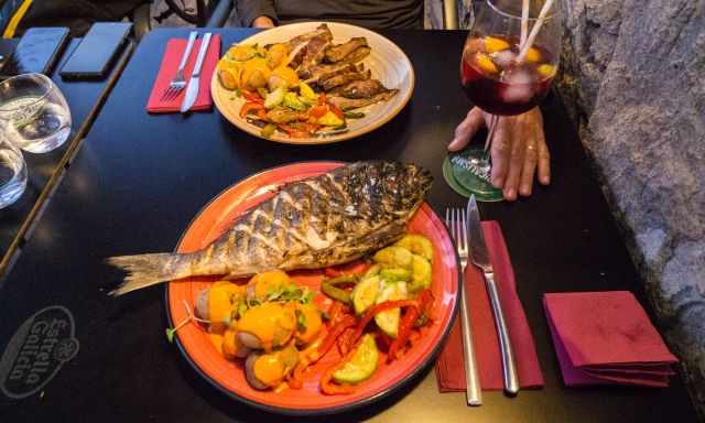 A grilled Dorada and pork in the restaurant