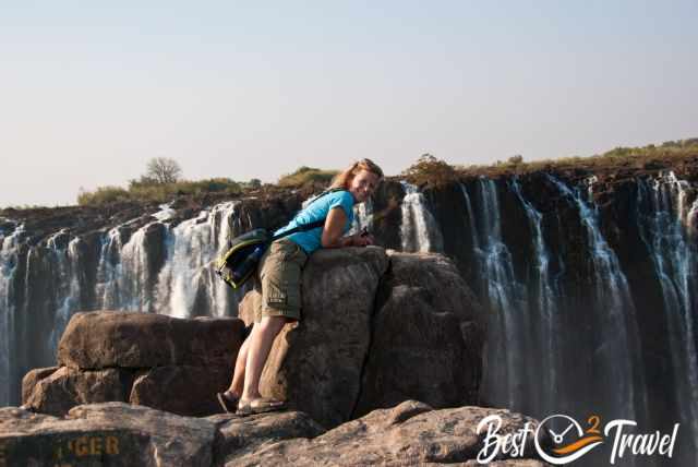 A woman in front of the Victoria Falls