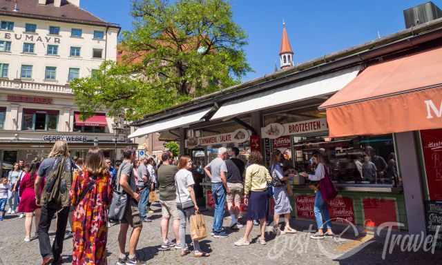 People line up to get a Leberkäs Semmeln