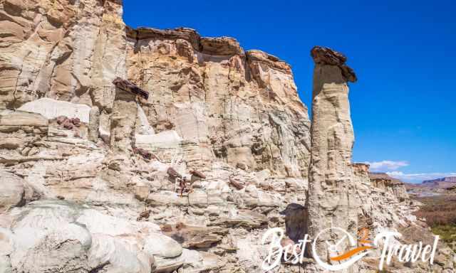 The first hoodoo group and a man looking tiny in the middle