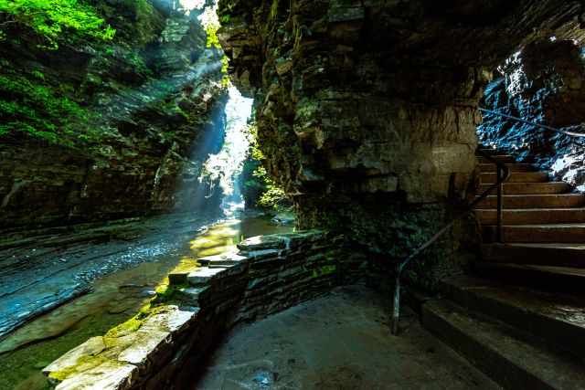 A staircase with railing along the gorge