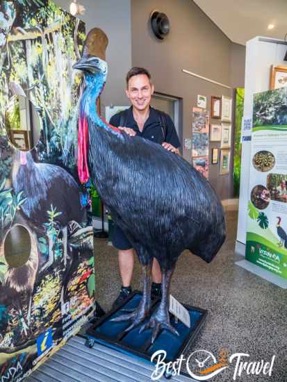 A Cassowary statue and a 1,80 m high man next to it.