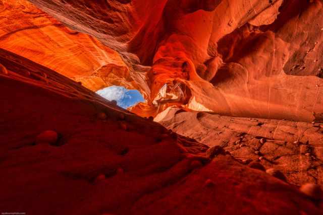 Blue sky with white clouds seen from inside the canyon