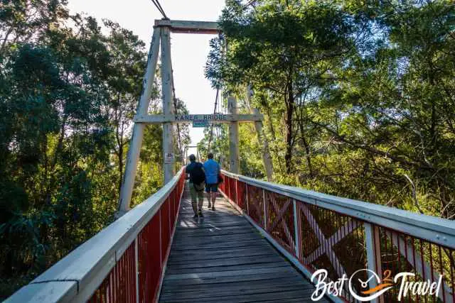 Two men crossing the Yarra River on Kanes Bridge