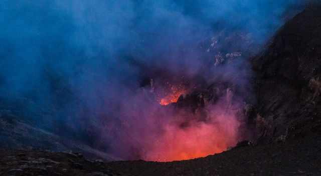 Two volcanic vents are erupting spitting red hot lava