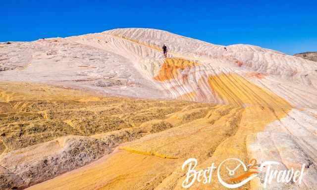 A hiker on Yellow Rock in GSENM