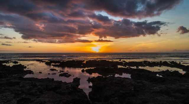 Sunset on Tanna island at the sea